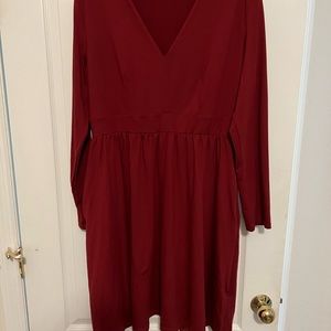 Women’s mid length long sleeved maroon dress with pockets